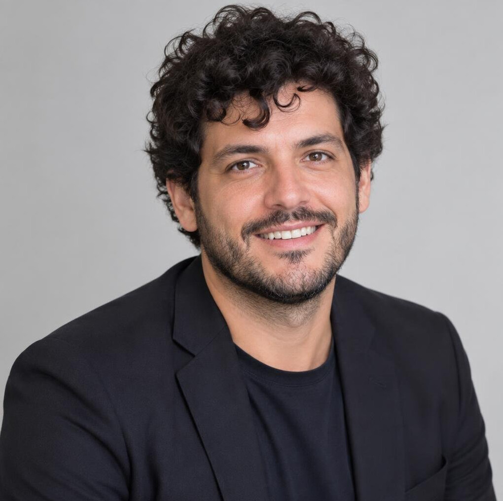 Portrait of a man with curly hair and a beard