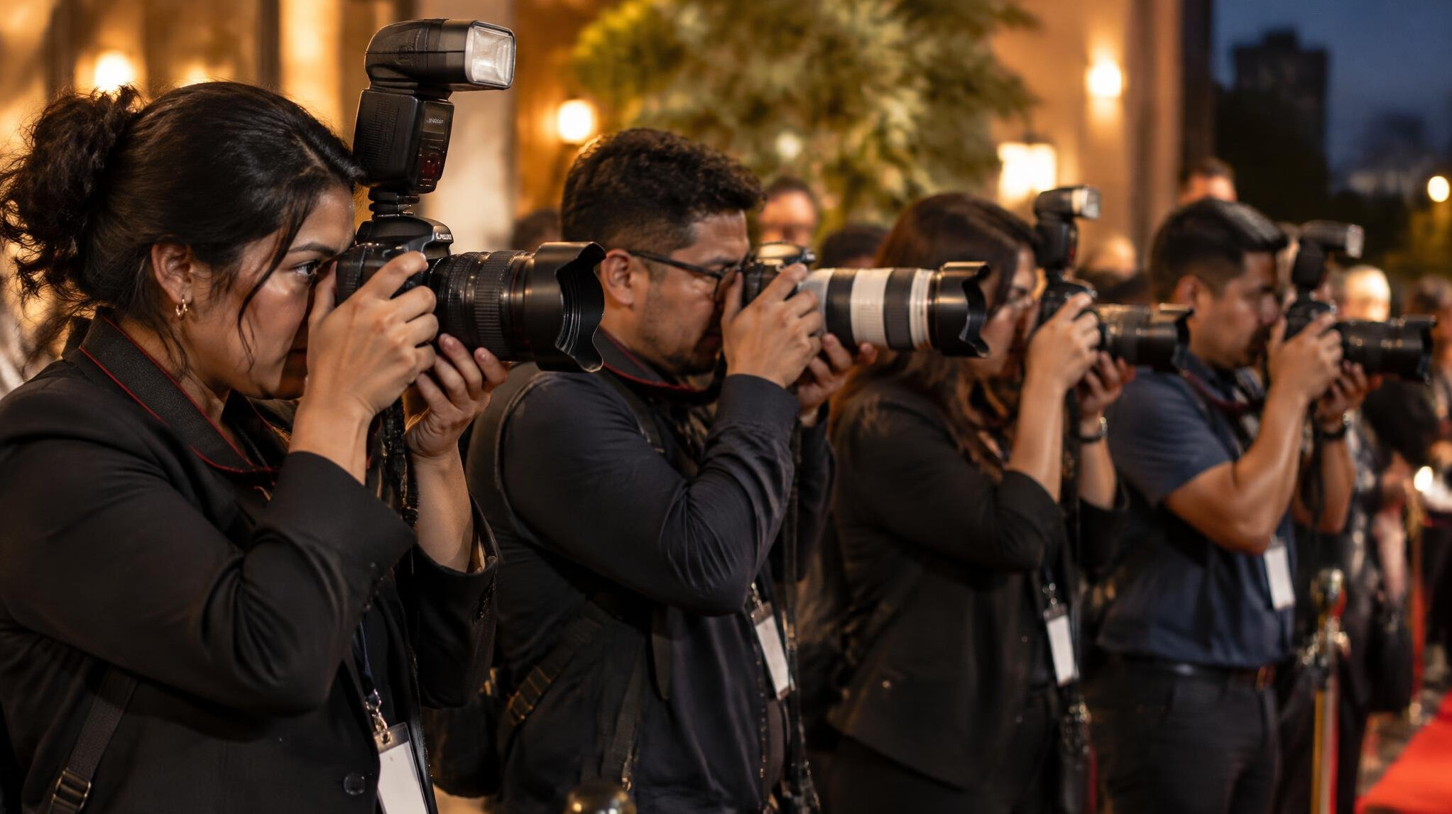 Photographers at a media event with cameras